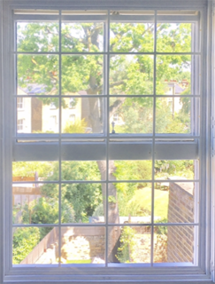 Georgian style security bar grille fitted to window in West London.